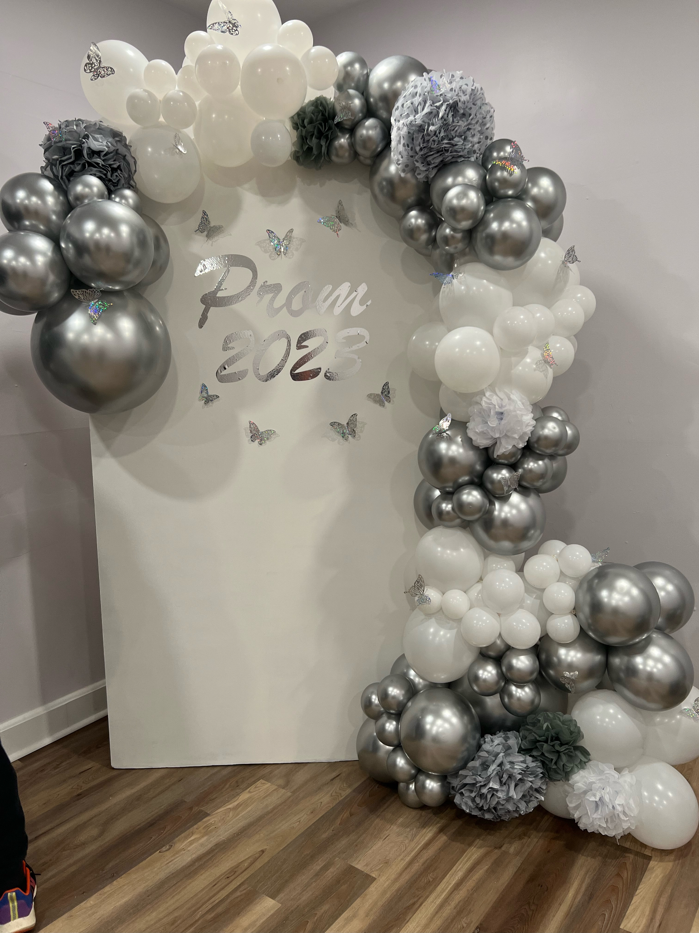 Lavender and blush balloon arch over a staircase
